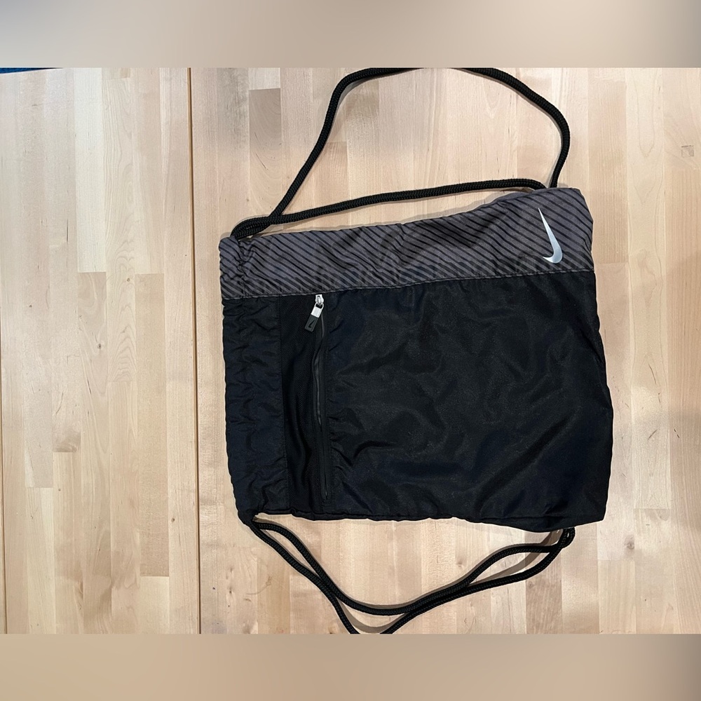 Black And Grey Nike Draw String Backpack. - image 1